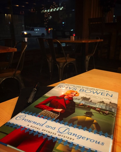 Some light reading over dinner – Crowned and Dangerous by Rhys Bowen