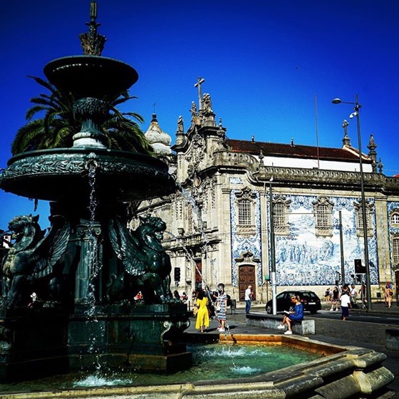 Fonte dos Leões, Praça de Gomes Teixeirax, Porto, Portugal with Igreja do Carmo in the background via Instagram
