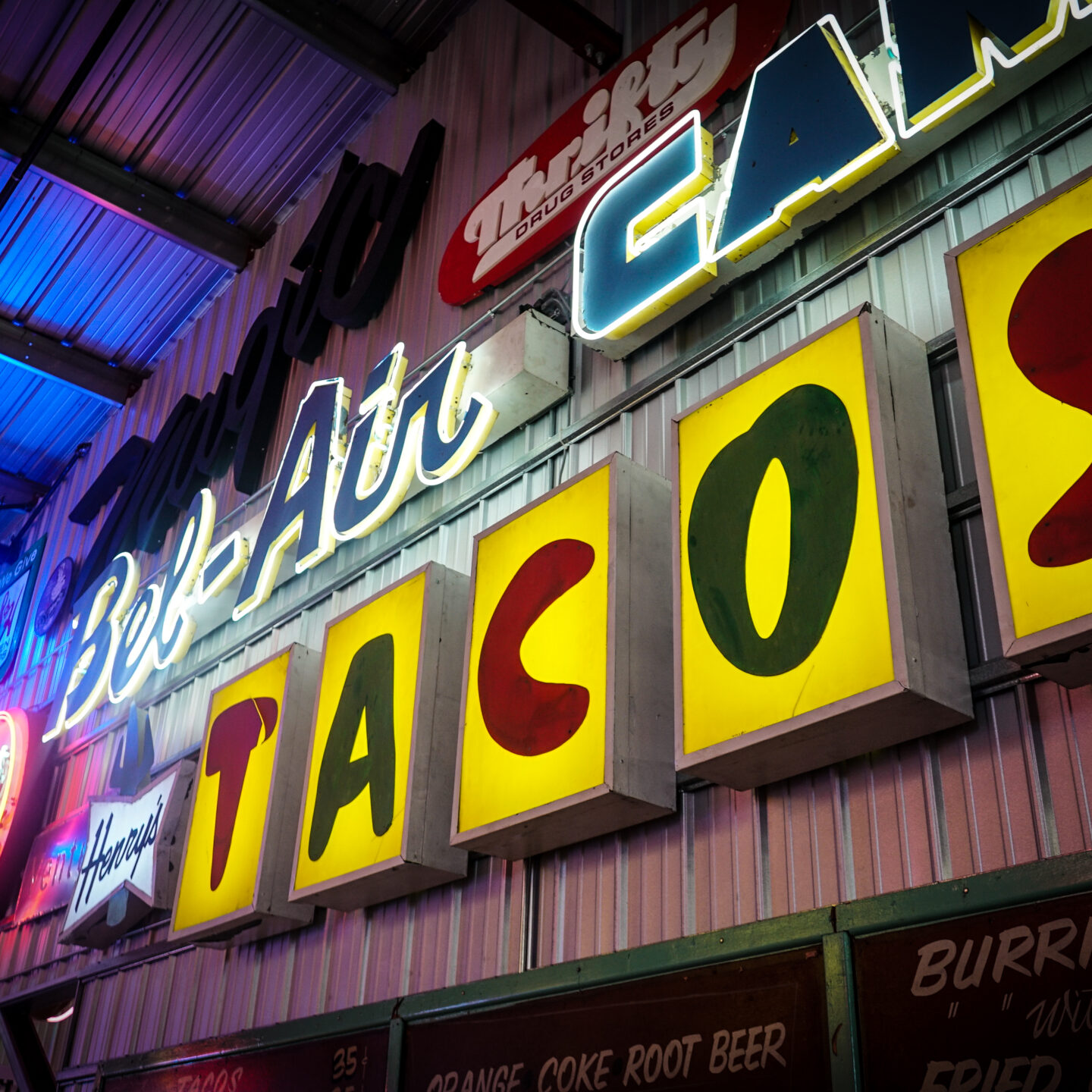 Signs from Henry’s Tacos and Bel-Air Camera Signs, Valley Relics Museum, Van Nuys, California [Photography]