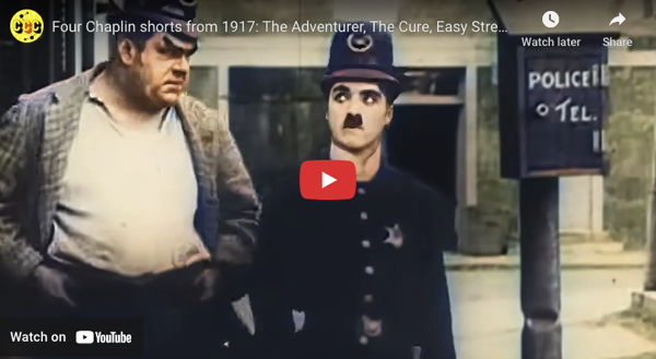 The image is a screenshot from a YouTube video featuring two characters from a silent film. The character on the left is a heavyset man wearing a checkered jacket over a white shirt, with his hands in his pockets, looking serious. The character on the right is dressed in a dark police uniform with a hat, sporting a distinctive mustache, and appears to be looking at the camera with a surprised expression. In the background, there is a sign that reads "POLICE TEL." The video is titled "Four Chaplin shorts from 1917: The Adventurer, The Cure, Easy Stre..." and includes a play button overlay, indicating it is a video thumbnail. The overall color tone of the image is muted, with a vintage appearance, consistent with early 20th-century film.</p>

<p>Provided by @altbot, generated privately and locally using Ovis2-8B