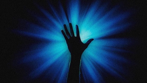 The image features a silhouette of a human hand reaching upwards against a dark background. The hand is positioned centrally, with fingers spread apart, creating a stark contrast against the bright blue light emanating from behind it. The light rays are radiating outward in all directions, creating a starburst effect that highlights the hand's outline. The blue light is intense and vibrant, with varying shades that suggest depth and intensity. The overall composition emphasizes the hand as the focal point, with the blue light adding a sense of drama and focus to the image.</p>

<p>Provided by @altbot, generated privately and locally using Ovis2-8B